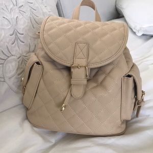 cream quilted mini backpack